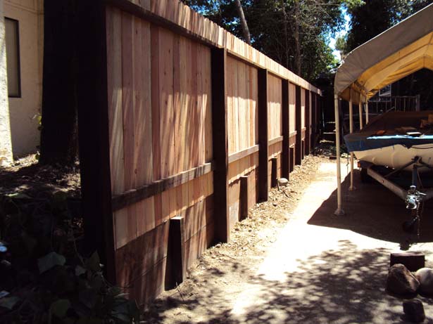 redwood fence with 3 ft retaining wall