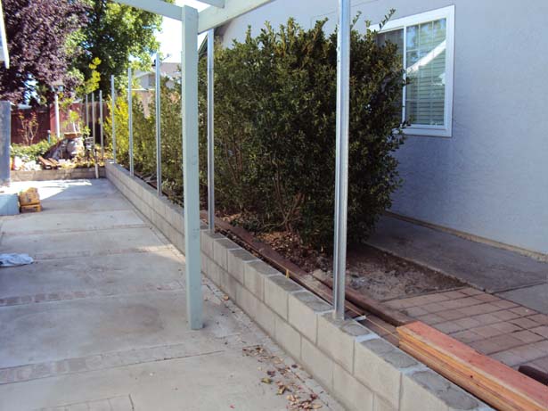 fence with block retaining wall